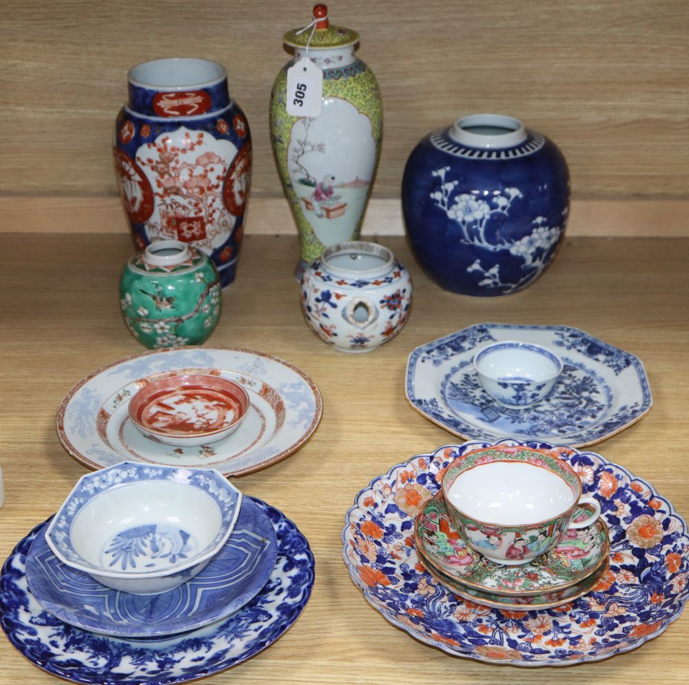 A collection of mixed Chinese and Japanese porcelain and pottery including a Nanking Cargo blue and white tea bowl, a 19th century